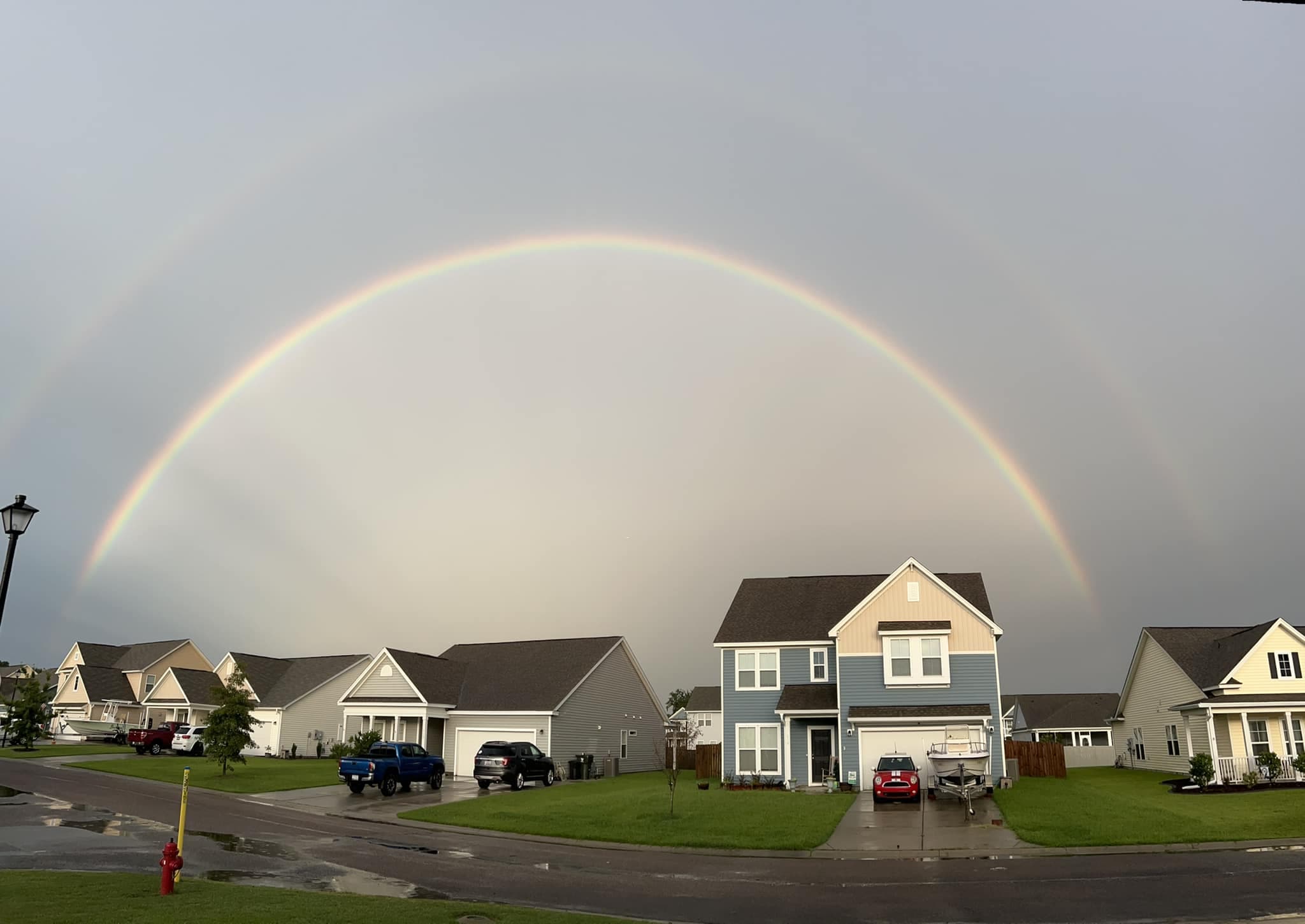 Double rainbow arching over Strawberry Station after a summer storm